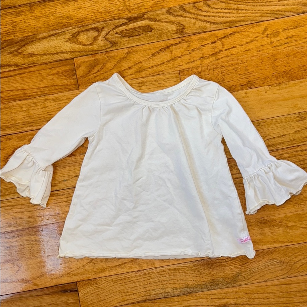 Ruffle Butts Cream Long Sleeve Tee with Flowy Design